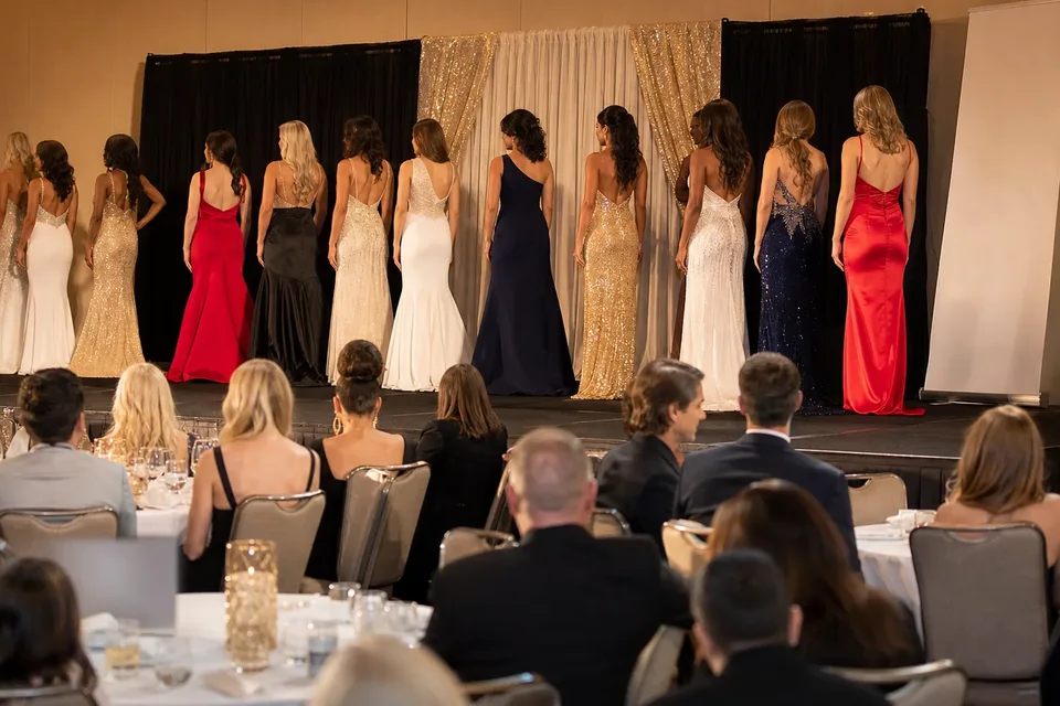 Brand marketing manager reviewing pageant sponsorship options at her desk